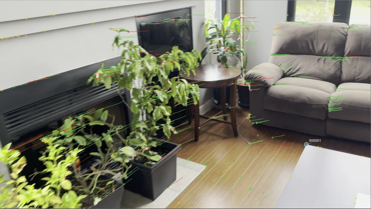 A living room with the table's corner keyed as it leaves the frame: the manual point 900001, picked, a blue circle on the corner